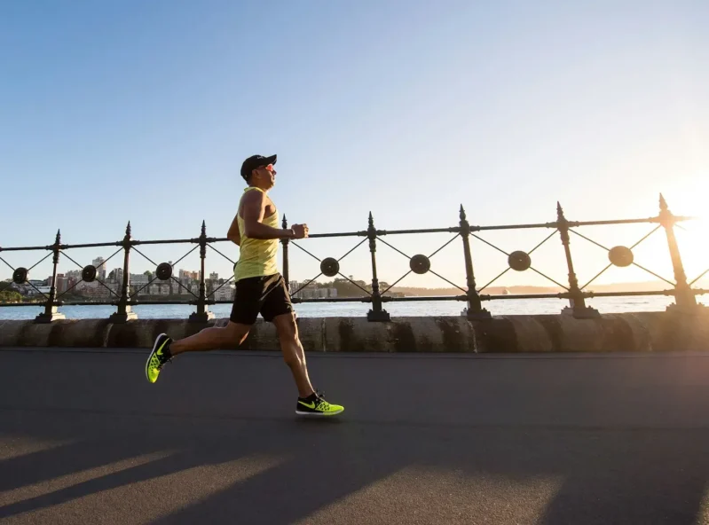 Man running along the water front - about fithealthyhumans..com